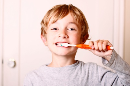 San Francisco, CA boy brushing his teeth before visiting San Francisco Dental Arts