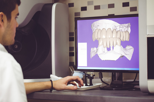 A Dentist evaluating Digital Impresssions