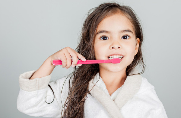 Young girl brushing her teeth at San Francisco Dental Arts in San Francisco, CA