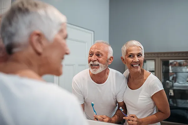 An older couple brushing and flossing at San Francisco Dental Arts in San Francisco, CA