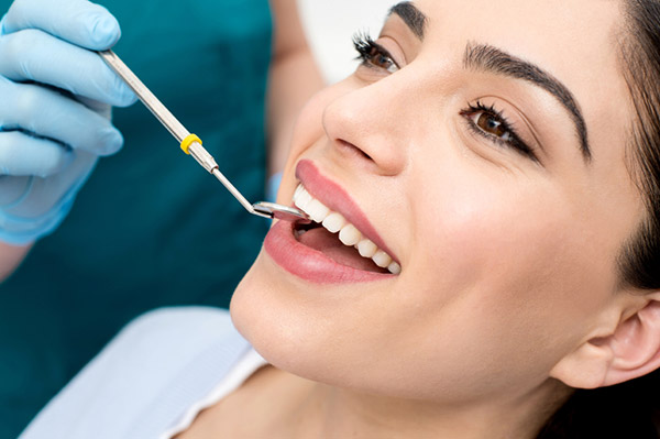 Patient getting a dental exam from San Francisco Dental Arts in San Francisco, CA